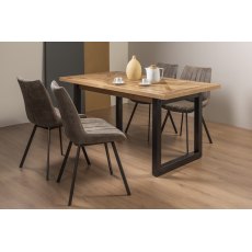 Indus Rustic Oak 4-6 Seater Dining Table with Peppercorn Legs & 4 Fontana Tan Faux Suede Fabric Chairs with Grey Hand Brushing on Black Powder Coated Legs