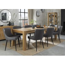 Turin Light Oak 6-10 Seater Dining Table & 8 Cezanne Dark Grey Faux Leather Chairs with Sand Black Powder Coated Legs