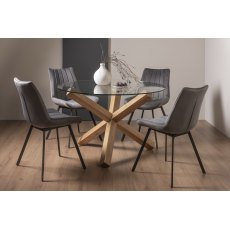 Turin Clear Tempered Glass 4 Seater Dining Table with Light Oak Legs & 4 Fontana Grey Velvet Fabric Chairs with Grey Hand Brushing on Black Powder Coated Legs