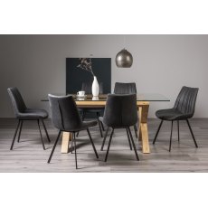 Turin Clear Tempered Glass 6 Seater Dining Table with Light Oak Legs & 6 Fontana Dark Grey Suede Fabric Chairs with Grey Hand Brushing on Black Powder Coated Legs