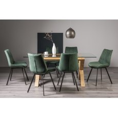 Turin Clear Tempered Glass 6 Seater Dining Table with Light Oak Legs & 6 Fontana Green Velvet Fabric Chairs with Grey Hand Brushing on Black Powder Coated Legs