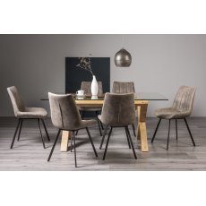 Turin Clear Tempered Glass 6 Seater Dining Table with Light Oak Legs & 6 Fontana Tan Faux Suede Fabric Chairs with Grey Hand Brushing on Black Powder Coated Legs