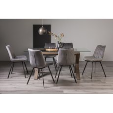 Turin Clear Tempered Glass 6 Seater Dining Table with Dark Oak Legs & 6 Fontana Grey Velvet Fabric Chairs with Grey Hand Brushing on Black Powder Coated Legs