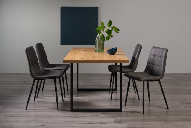 Gallery Collection Ramsay Rustic Oak Effect Melamine 6 Seater Dining Table with U Leg  & 4 Mondrian Dark Grey Faux Leather Chairs with Sand Black Powder Coated Legs