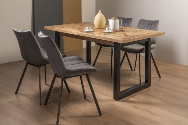 Signature Collection Indus Rustic Oak 4-6 Seater Dining Table with Peppercorn Legs & 4 Fontana Grey Velvet Fabric Chairs with Grey Hand Brushing on Black Powder Coated Legs