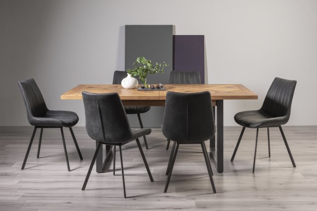Signature Collection Indus Rustic Oak 6-8 Seater Dining Table with Peppercorn Legs & 6 Fontana Dark Grey Faux Suede Fabric Chairs with Grey Hand Brushing on Black Powder Coated Legs