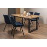 Signature Collection Indus Rustic Oak 4-6 Seater Dining Table with Peppercorn Legs & 4 Fontana Blue Velvet Fabric Chairs with Grey Hand Brushing on Black Powder Coated Legs