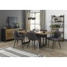 Signature Collection Indus Rustic Oak 6-8 Seater Dining Table with Peppercorn Legs & 6 Cezanne Dark Grey Faux Leather Chairs with Sand Black Powder Coated Legs