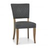 Bentley Designs Ellipse & Logan Rustic Oak 4 Seater Dining Set & 4 Uph Chairs- Dark Grey Fabric- chair front angle