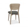 Bentley Designs Dansk Scandi Oak 6 Seater Dining Set & 6 Upholstered Veener Back Chairs in Cold Steel Fabric- chair back angl