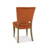 Bentley Designs Logan Rustic Oak Upholstered Chair- Rust Velvet Fabric- back angle shot