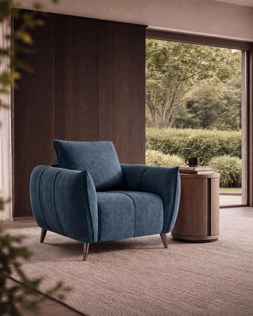 The Elara Armchair in Teal pairs rich colour with a relaxed, contemporary design. Its softly curved f...