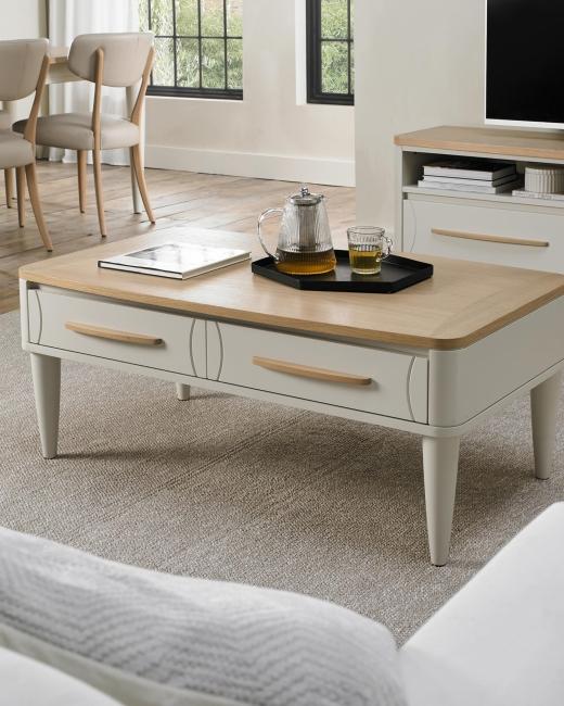 Larsen combines Scandinavian oak veneer tops with soft grey bases for a clean, timeless look. Softene...