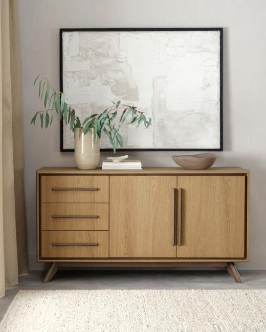 Storage should never feel like an afterthought. The Kristen sideboard combines oak with light weather...